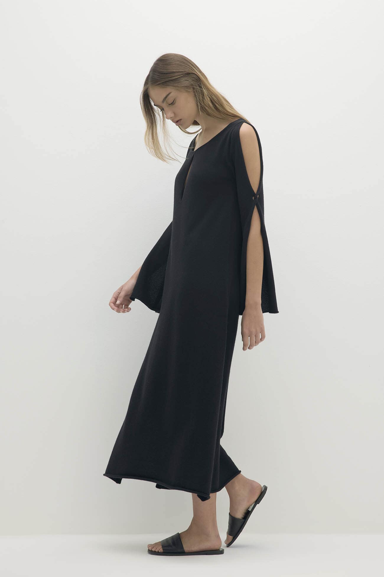 Elegant black dress from the Dresses Jumpsuits collection, showcasing a stylish cold-shoulder design.